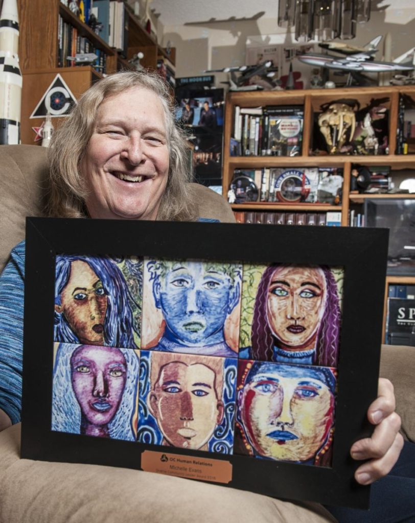 Michelle Evans, a transgender woman from Lake Forest, holds the award she received when honored at the OC Human Relations AWARDS 45 event at the Grove in Anaheim. ///ADDITIONAL INFORMATION: Slug: michelleevans.050616, Day: Friday, May 6, 2016 (5/6/16), Time: 12:20:36 PM, Location: Lake Forest, California - - MARK RIGHTMIRE, STAFF PHOTOGRAPHER